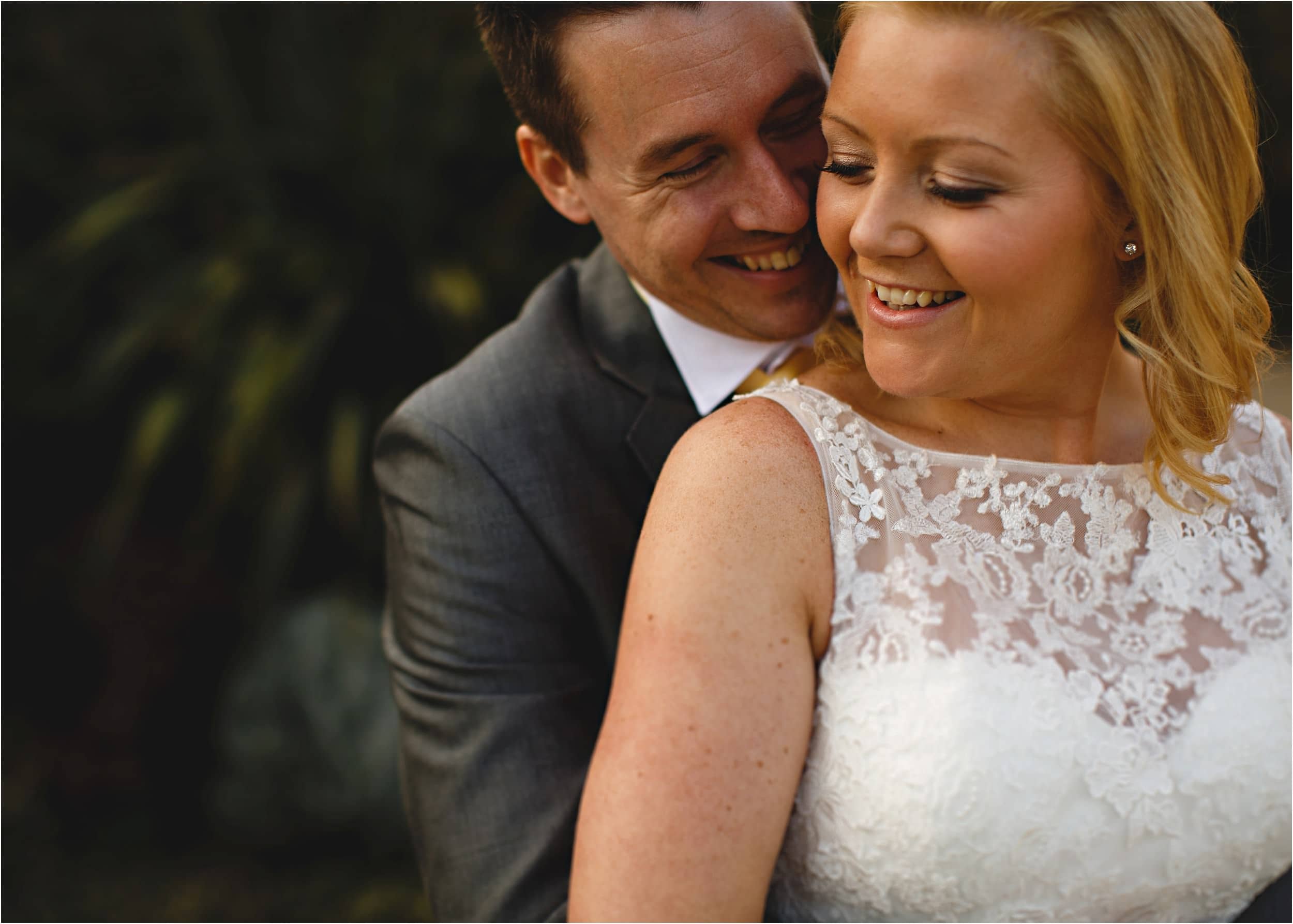 bride and groom hugging