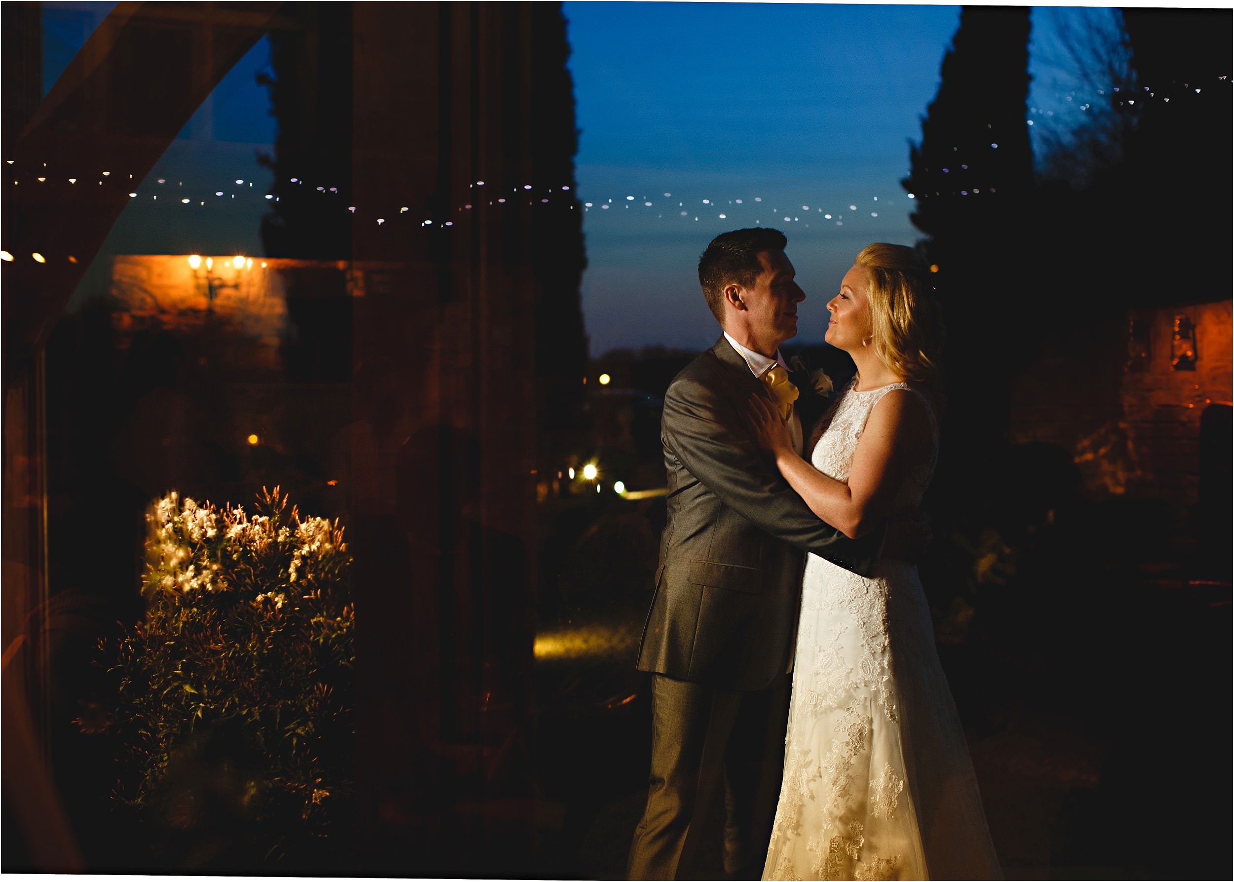 a dark lit shot of the bride and groom