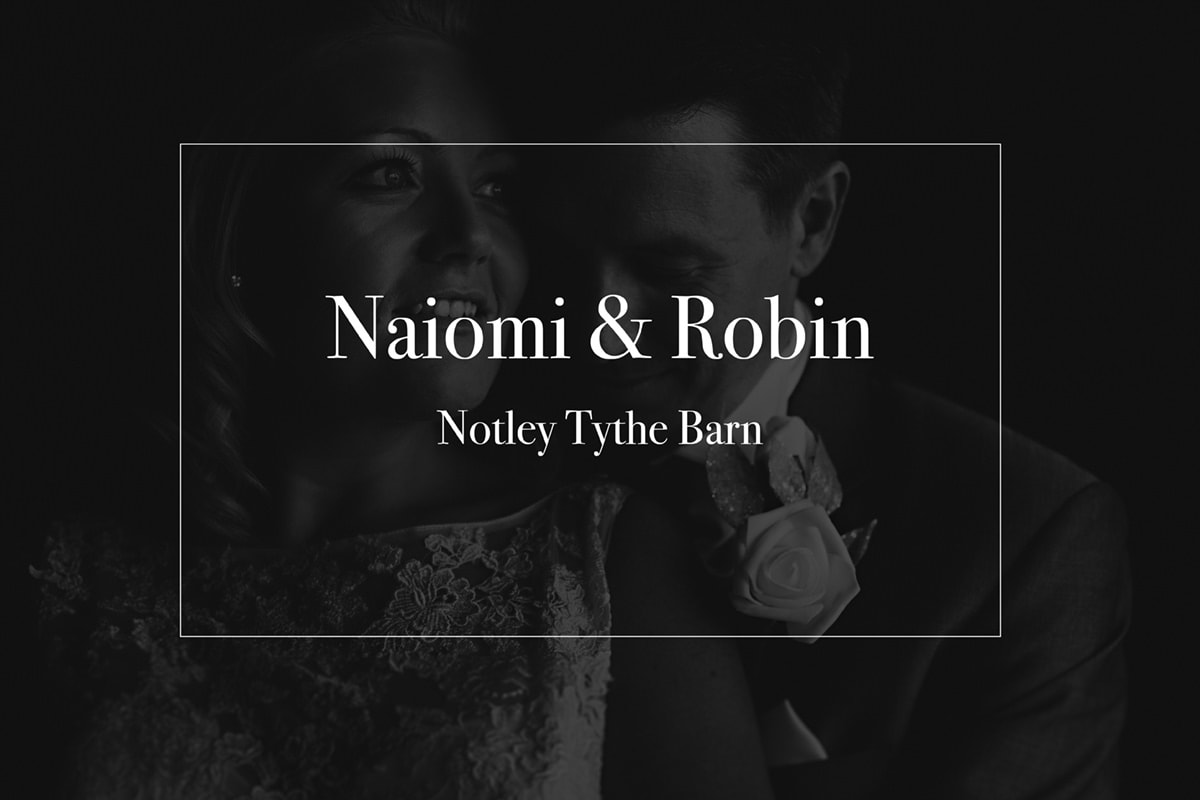 A black and white photo of a bride and groom at Notley Tythe Barn