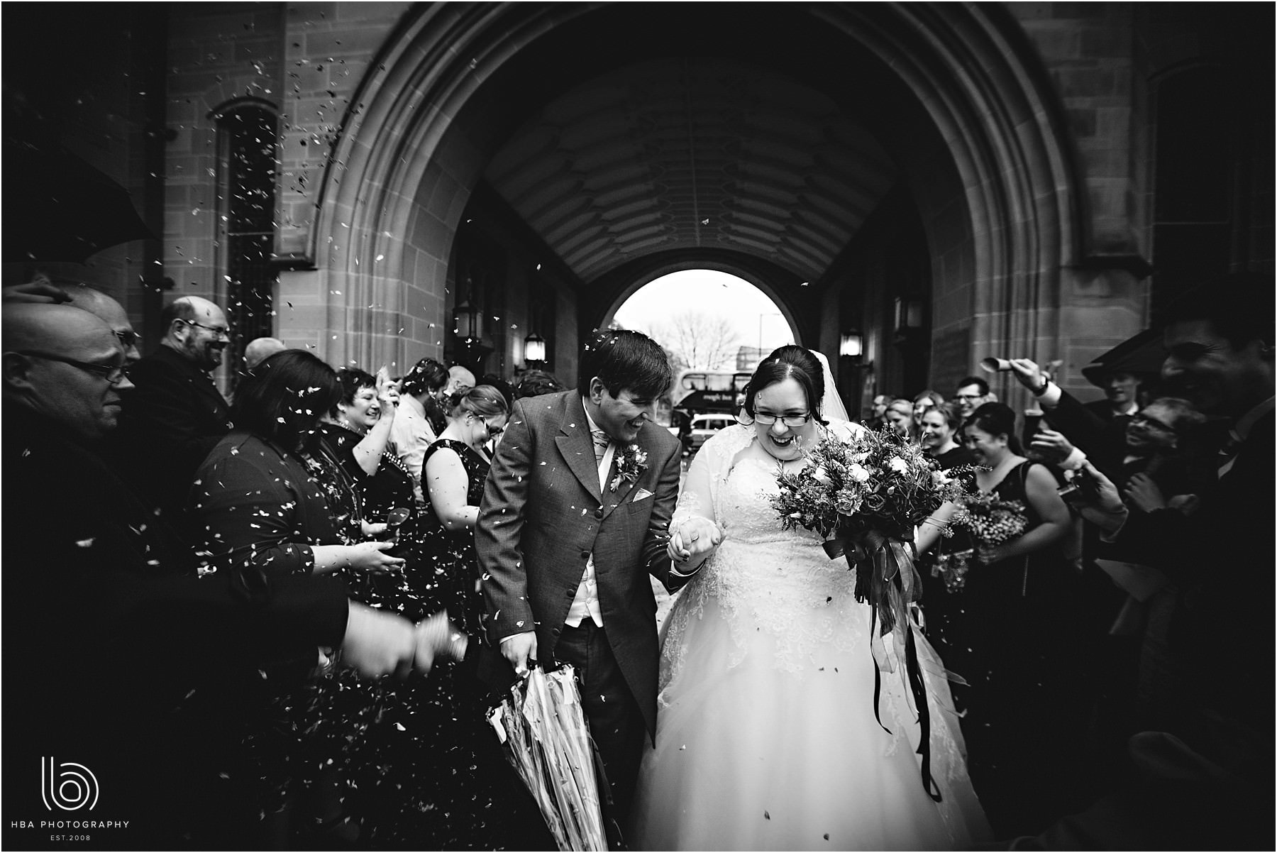 the bride & groom getting the confetti