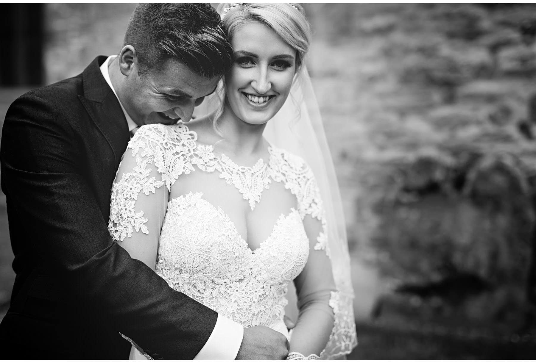 The bride & groom having a cuddle