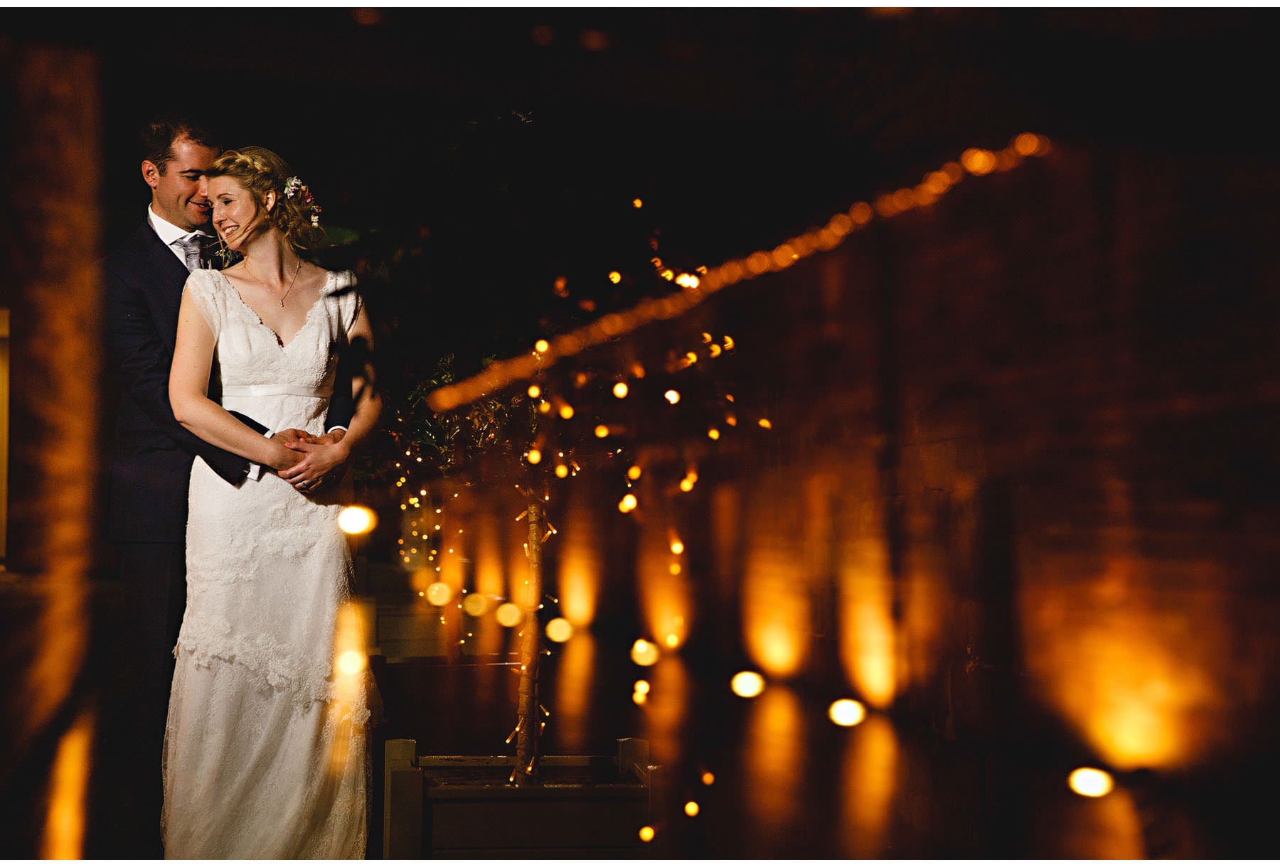 the couple in the lit courtyard
