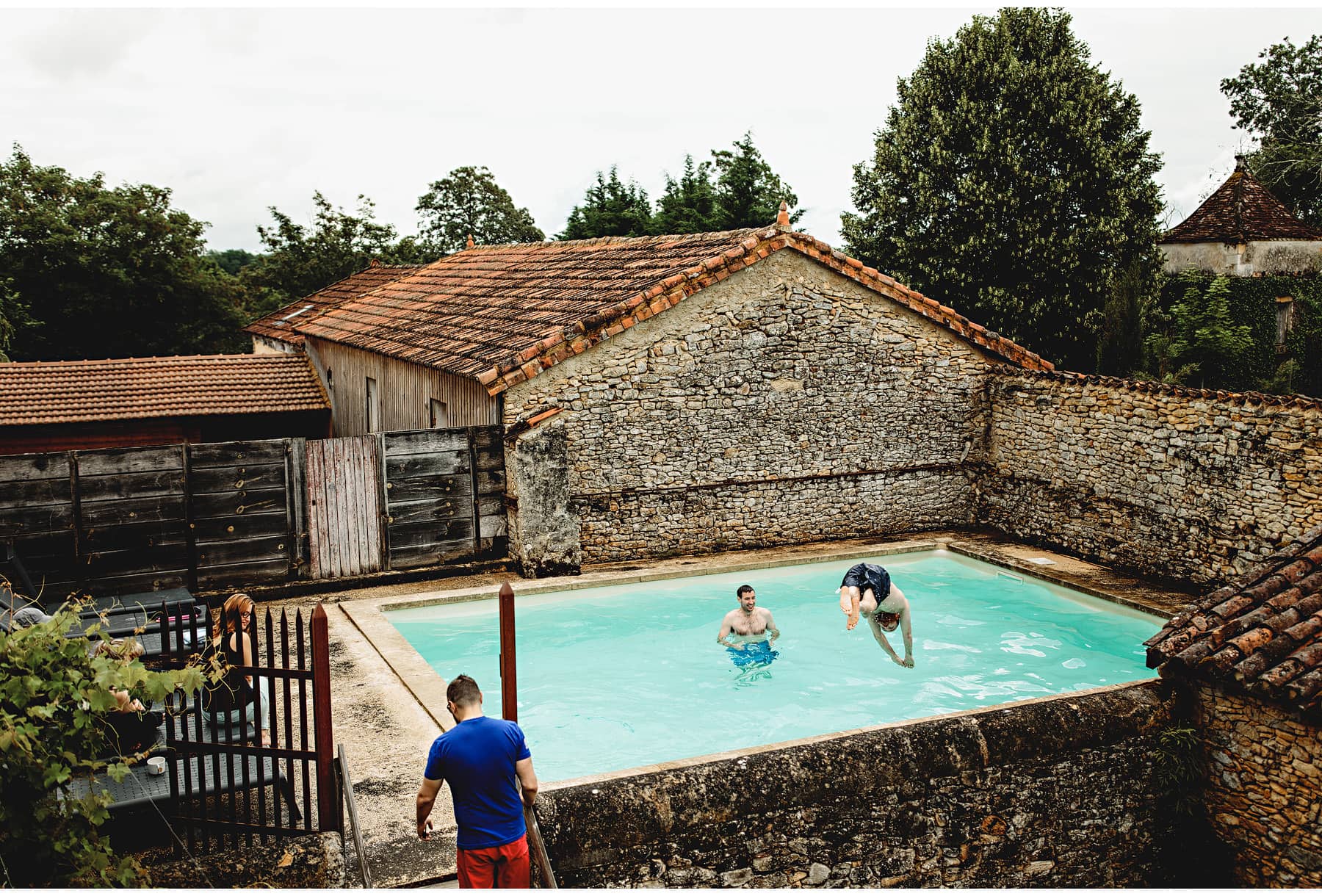 wedding guests using the pool at Château Cazenac