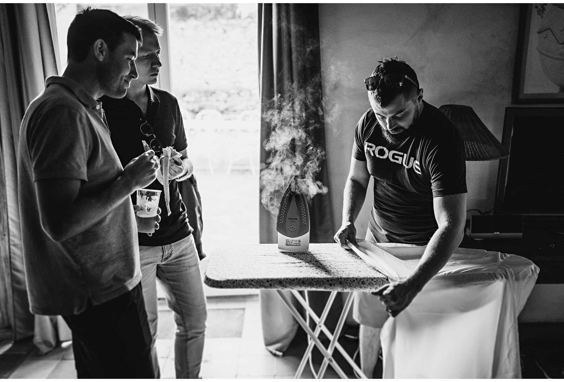The groom ironing his clothes