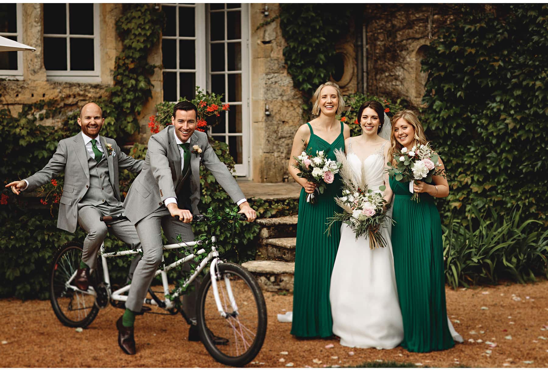 the bride and groo with their bridesmaids and groomsmen