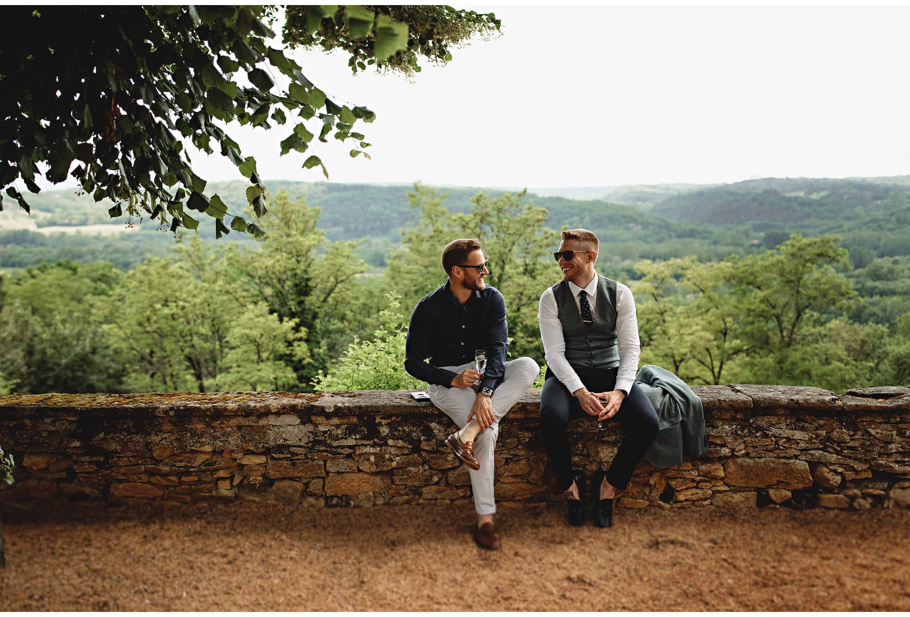 guests relaxing with the south of france countryside in the background