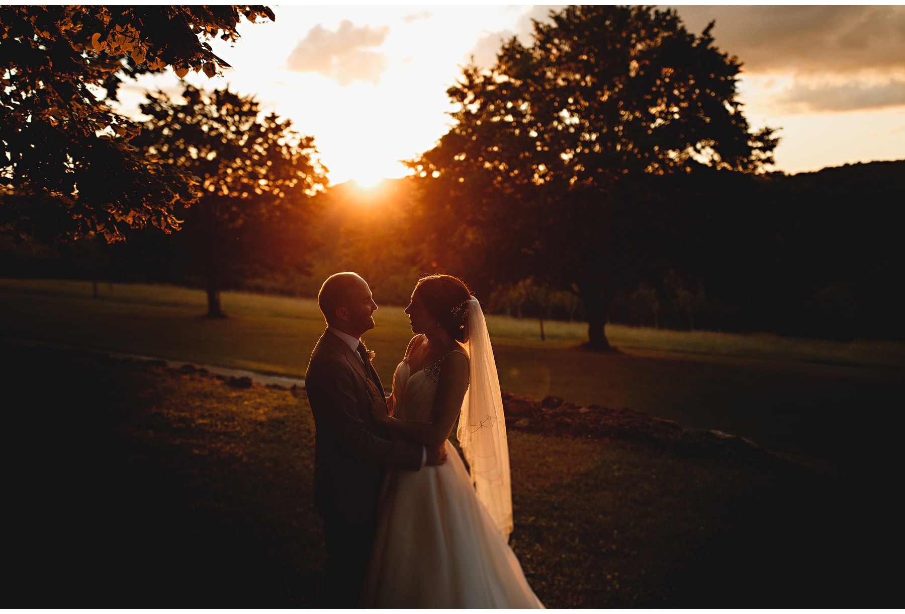 the bride & groom at sunset