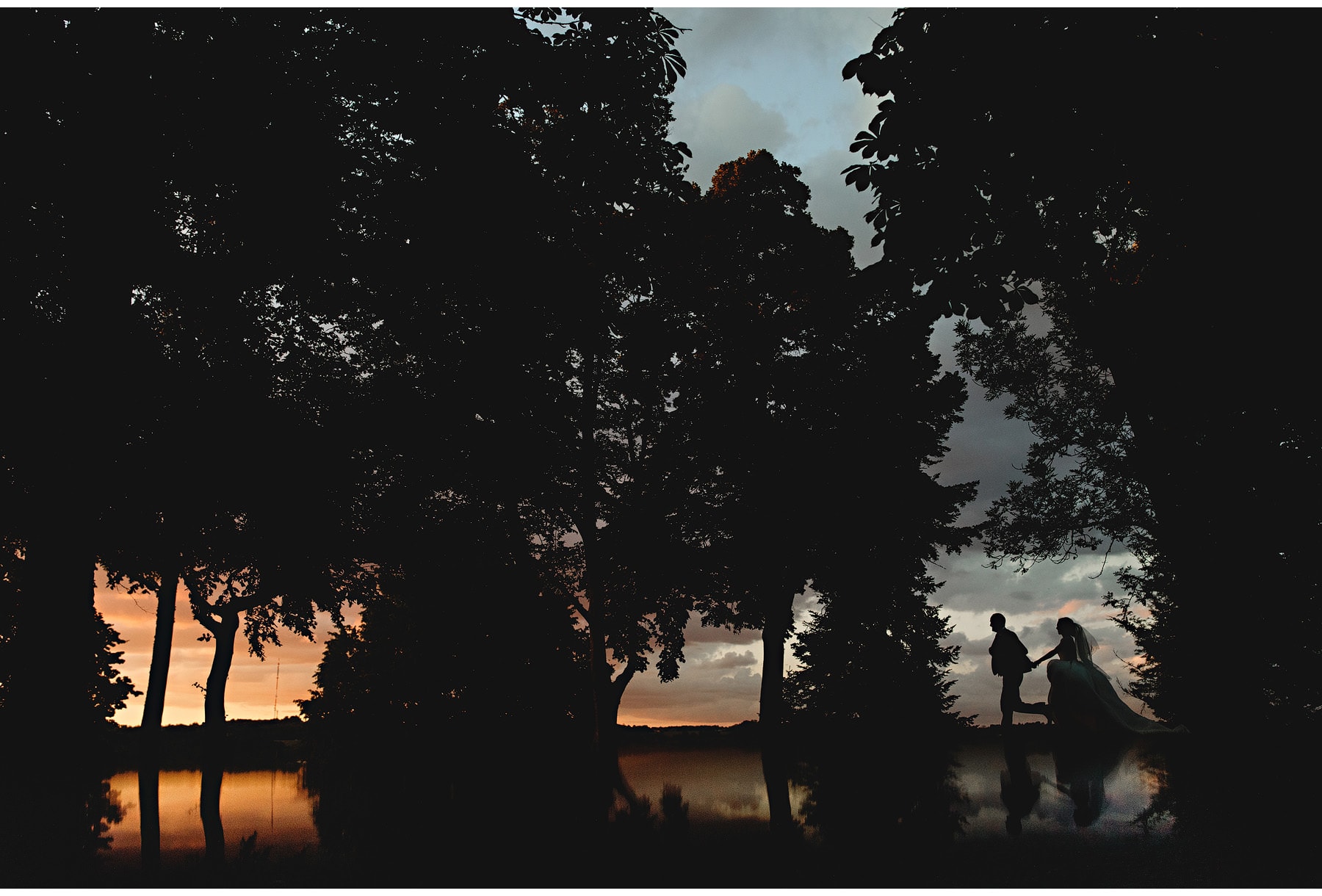 the bride & groom at sunset
